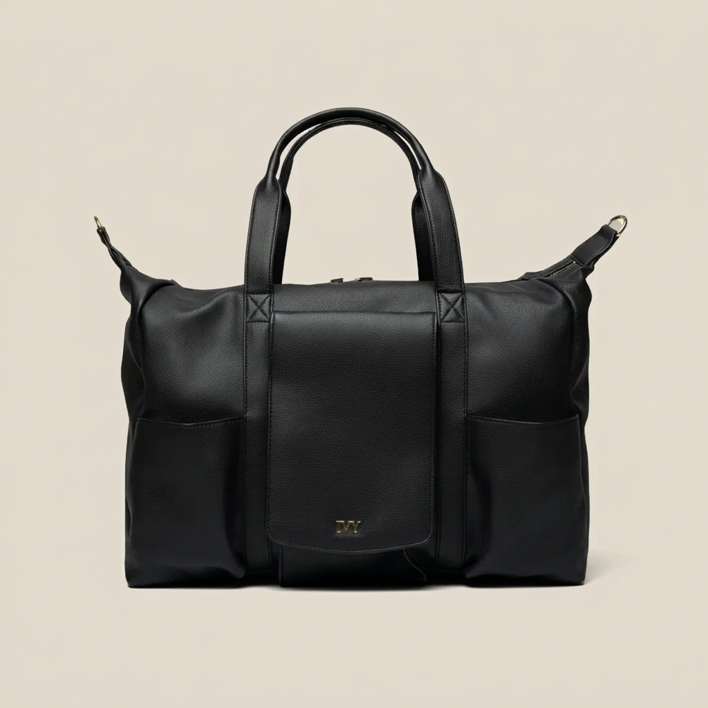 Black premium leather mommy bag with a the IVY brand logo on a white background